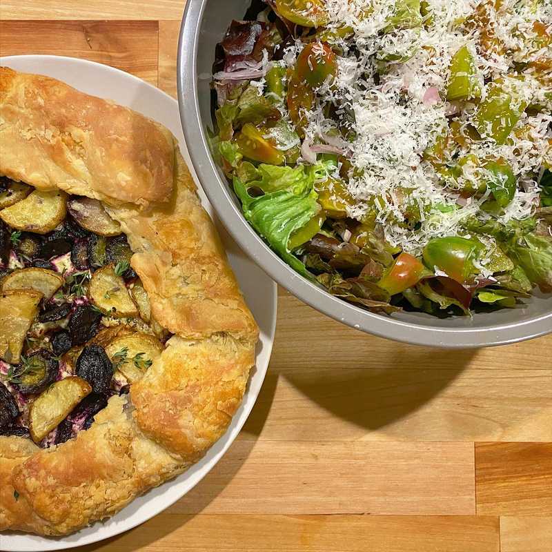 Clean out the fridge dinner - potato, purple carrot, and goat cheese galette with lots of thyme and rosemary.