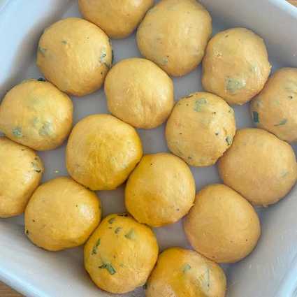 Mix everything but the herbs and butter and bulk ferment at room temp overnight. Deflate the dough, mix in the herbs and divide into 16 40 grams balls. Place rolls in a greased 8"x8" baking dish. Prove a 2nd time for 3 hours until the rolls are puffy and no space remains between them in the dish, brush the tops generously with butter, bake @ 350F for 25-30 mins.