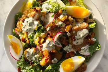 Dinner salad with crispy smashed potatoes