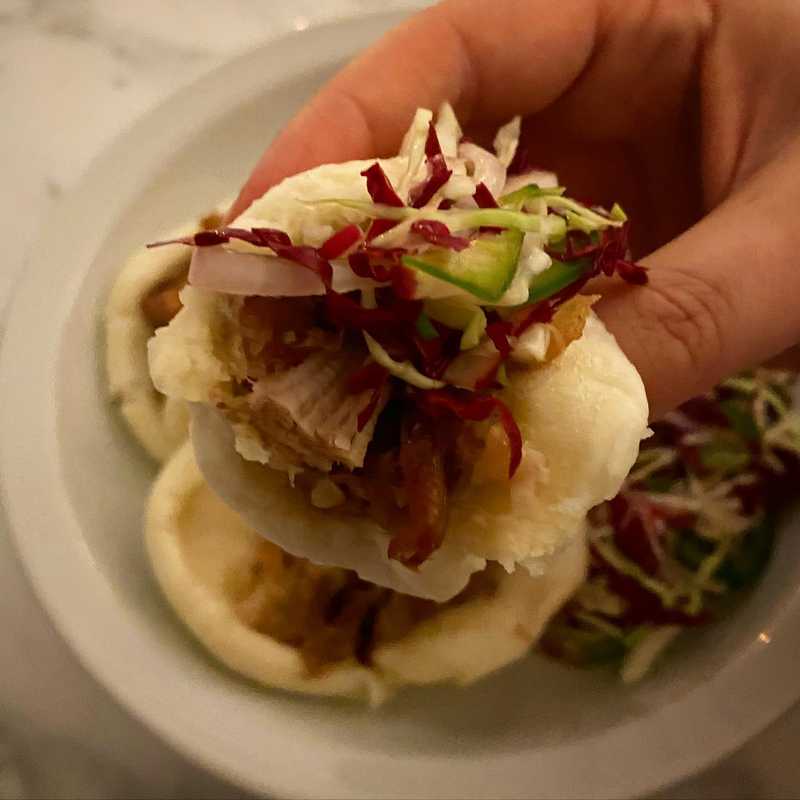 Bao-za! Slow roasted pork belly bao with a cabbage, radicchio, shallot and jalapeño slaw. Slaw is lightly dressed with a rice vinegar, lime, sugar, salt…